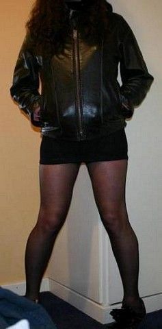 Leather jacket, short skirt and stockings
