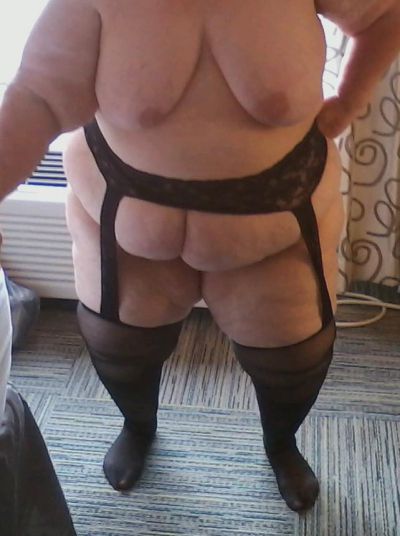 Garter belt and stockings and showing my big, natural, 48DD tits.