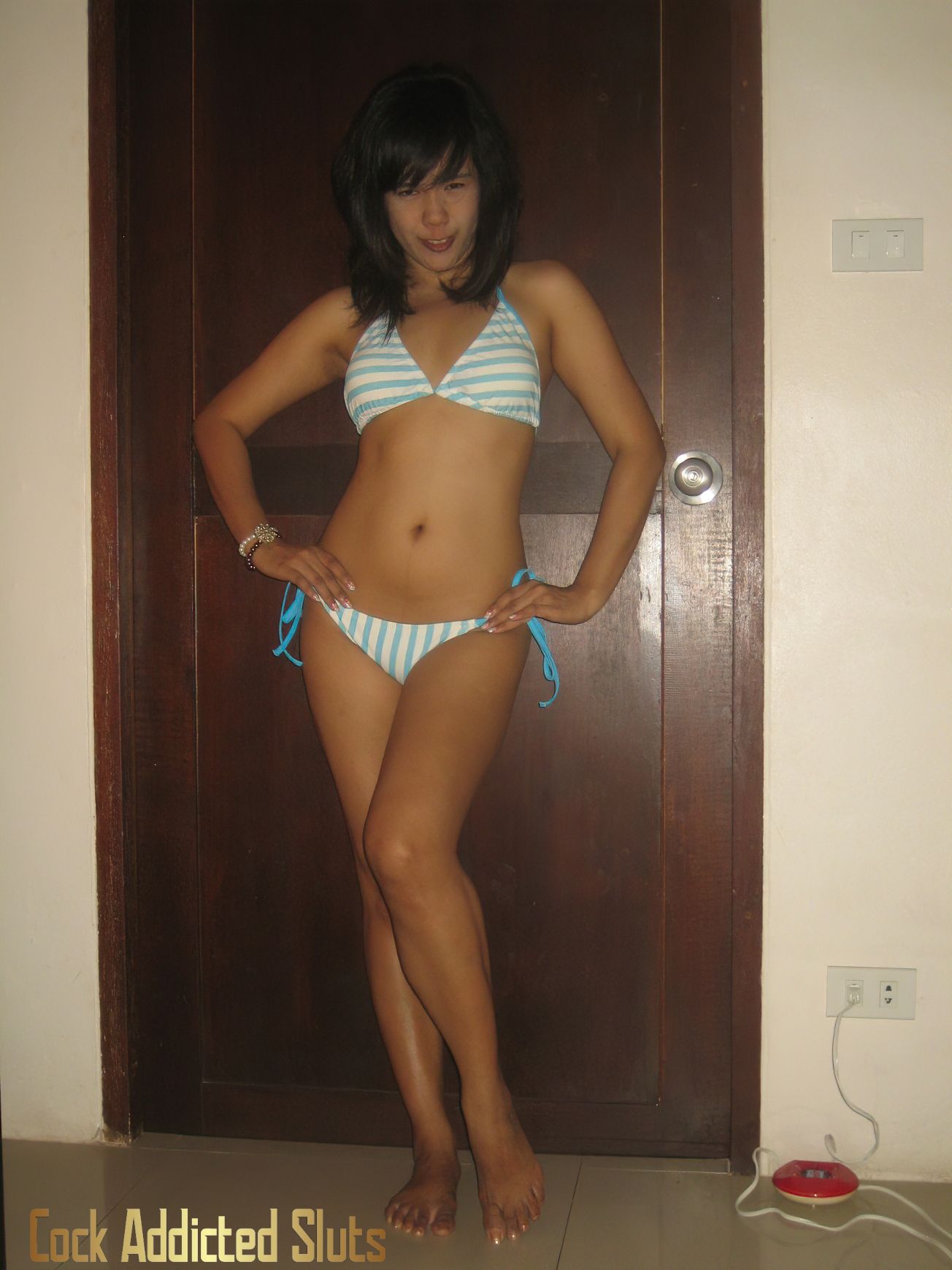 Slim flat Thai teen in bikini showing tits 4