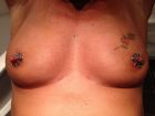 Slut D nipple piercings