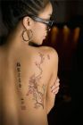 asian-flower-tattoo-on-girl-bak