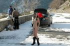 Sporty-girl-with-hairy-pussy-posing-naked-on-snow-covered-road-1