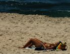 Topless_woman_sunbathing,_Aveiro,_Portugal