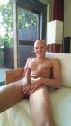 Shaven nudist exposing himself