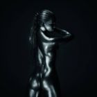 61179273-fit-athletic-woman-in-silver-body-paint-standing-back-to-camera-square-compostion