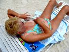 Granny shows nipple on the beach